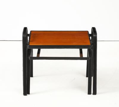 Jacques Adnet Set of two stitched leather nesting tables by Jacques Adnet