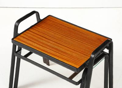 Jacques Adnet Set of two stitched leather nesting tables by Jacques Adnet