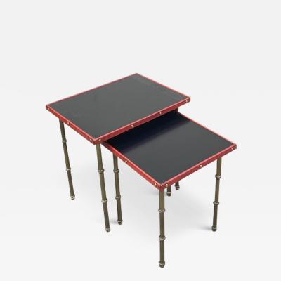 Jacques Adnet Set of two stitched leather nesting tables by Jacques Adnet