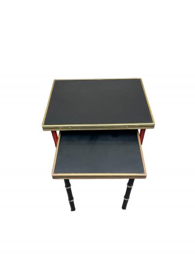 Jacques Adnet Set of two stitched leather nesting tables by Jacques Adnet