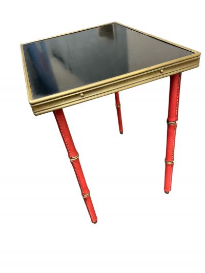 Jacques Adnet Set of two stitched leather nesting tables by Jacques Adnet