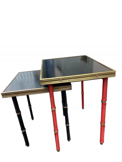 Jacques Adnet Set of two stitched leather nesting tables by Jacques Adnet