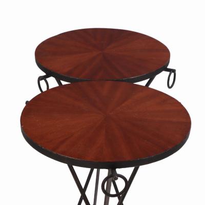 Jean Michel Frank A pair of iron and mahogany drinks tables in the manner of Jean Michel Frank 