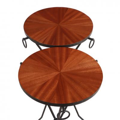 Jean Michel Frank A pair of iron and mahogany drinks tables in the manner of Jean Michel Frank