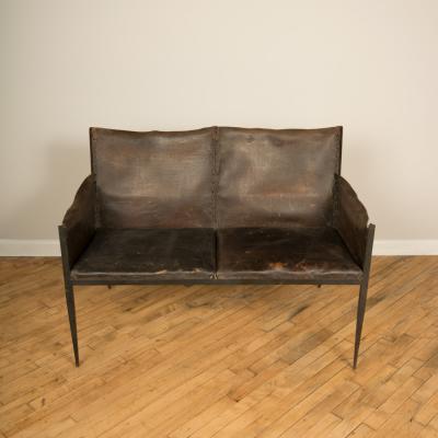 Jean Michel Frank An iron and leather Jean Michel Frank style settee