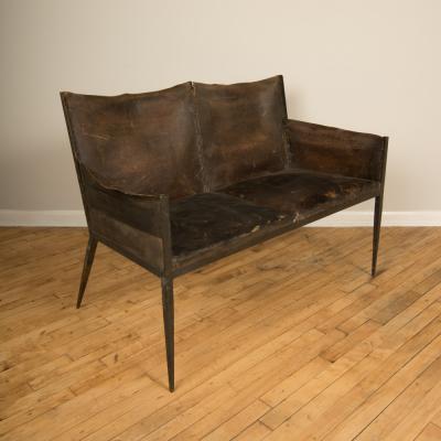 Jean Michel Frank An iron and leather Jean Michel Frank style settee