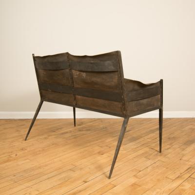 Jean Michel Frank An iron and leather Jean Michel Frank style settee