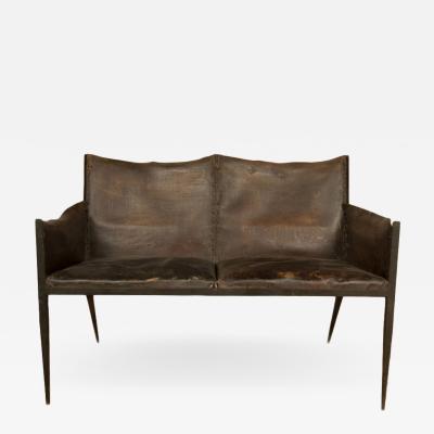 Jean Michel Frank An iron and leather Jean Michel Frank style settee