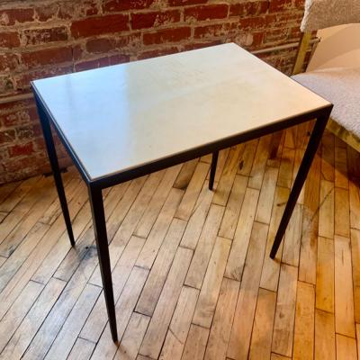 Jean Michel Frank An iron and parchment end table in the manner of Jean Michel Frank 