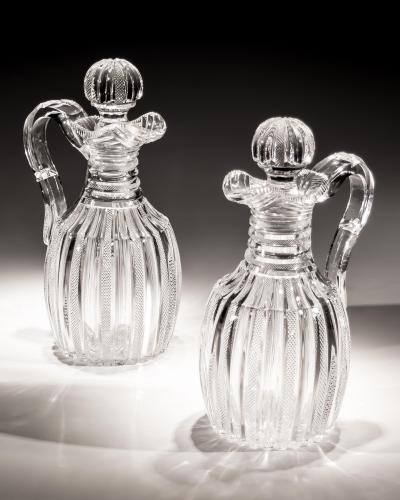 John Blades AN EXCEPTIONAL SUITE OF PILLAR FILE CUT GLASS JUGS BY JOHN BLADES