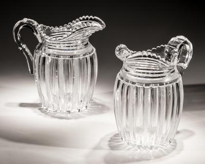 John Blades AN EXCEPTIONAL SUITE OF PILLAR FILE CUT GLASS JUGS BY JOHN BLADES