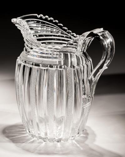 John Blades AN EXCEPTIONAL SUITE OF PILLAR FILE CUT GLASS JUGS BY JOHN BLADES