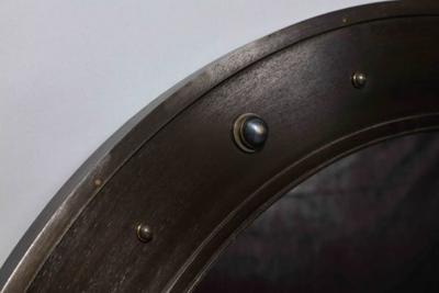 John McDevitt A 45 Circular Steel Mirror with Bosses in Statuary Bronze Finish