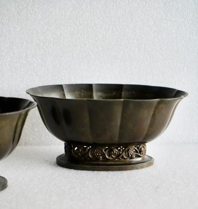 Just Andersen A pair of Just Andersen patinated disco metal planters