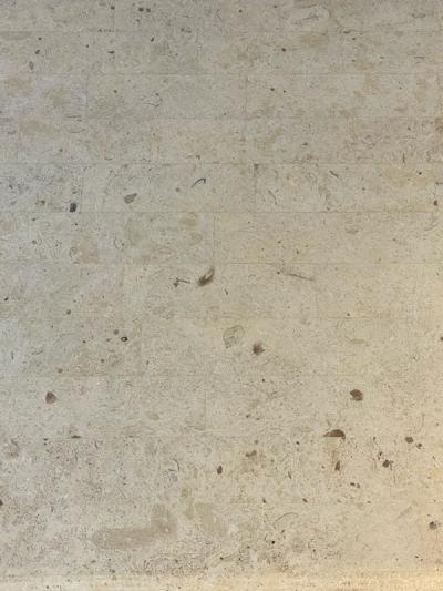 Karl Springer MODERN PAIR OF TRAVERTINE AND WICKER CORSETTED TABLES