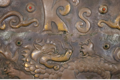 LARGE 19TH CENTURY COPPER REPOUSSE DRAGON WITH GLASS CABOCHON TRADE SIGN