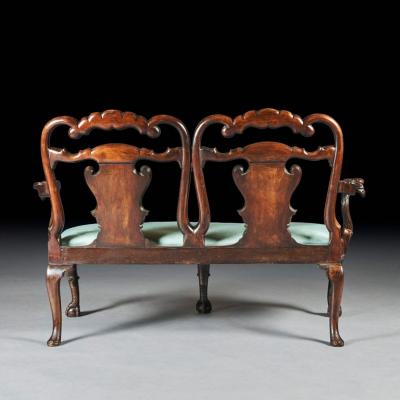 LATE 19TH CENTURY WALNUT TWIN CHAIR BACK SOFA AFTER A GEORGE II DESIGN 