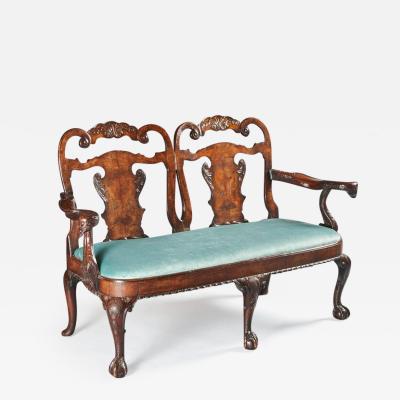 LATE 19TH CENTURY WALNUT TWIN CHAIR BACK SOFA AFTER A GEORGE II DESIGN 