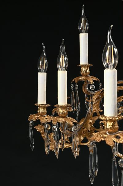 LOUIS XV STYLE GILT BRONZE AND CUT GLASS TWENTY FIVE LIGHT CHANDELIER