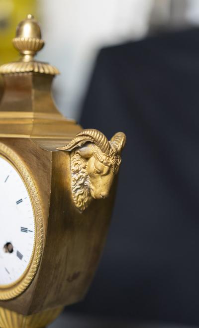 LOUIS XVI PERIOD GILT BRONZE RAMS HEAD CLOCK