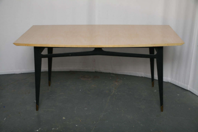 Laminated beech top and black lacquered wood base with brass tipped legs 