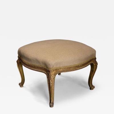 Large 19thc French carved giltwood stool with upholstered shaped seat