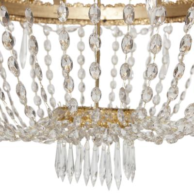 Large French Empire style glass and gilt bronze 18 light chandelier