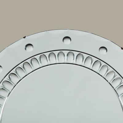 Large Italian Art Deco round mirror with highly decorative optic bullseye detail