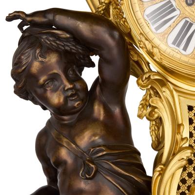 Large antique French Louis XV style patinated and gilt bronze clock set