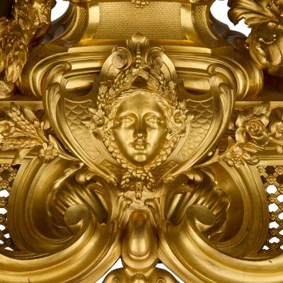 Large antique French Louis XV style patinated and gilt bronze clock set