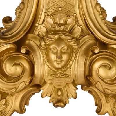 Large antique French Louis XV style patinated and gilt bronze clock set