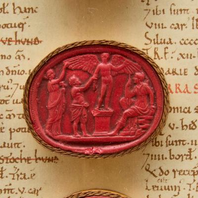 Large antique Italian Grand Tour red wax intaglios in giltwood frame
