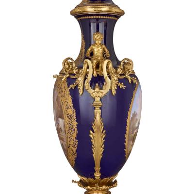 Large antique porcelain and ormolu vase painted with a genre scene
