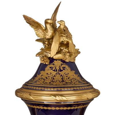 Large antique porcelain and ormolu vase painted with a genre scene