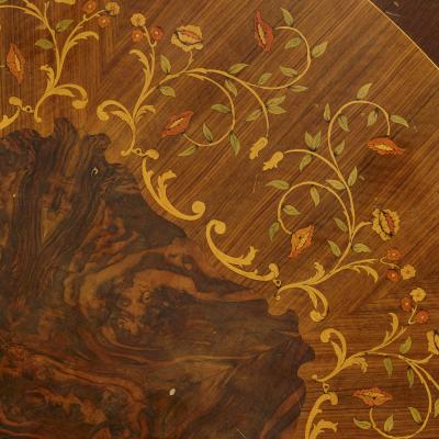 Large circular centre table adorned with gilt bronze and marquetry