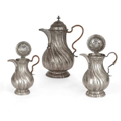 Large group of antique German pewter mugs tankards and ewers