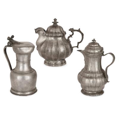 Large group of antique German pewter mugs tankards and ewers