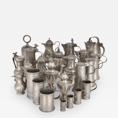 Large group of antique German pewter mugs tankards and ewers