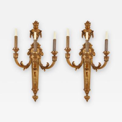 Large pair of Louis XVI style three branch ormolu wall lights