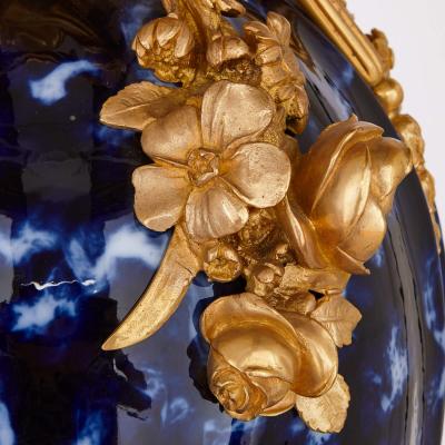 Large pair of Rococo style gilt bronze and blue ceramic vases