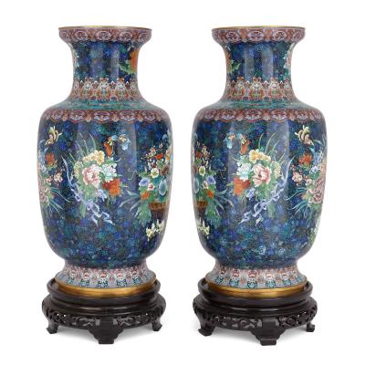 Large pair of floral Chinese cloisonn enamel vases on wooden plinths