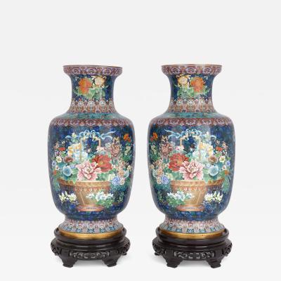 Large pair of floral Chinese cloisonn enamel vases on wooden plinths