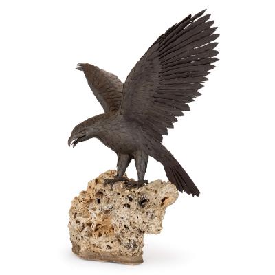Large patinated steel and rock model of an eagle