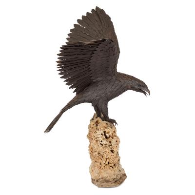 Large patinated steel and rock model of an eagle
