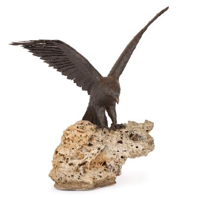 Large patinated steel and rock model of an eagle