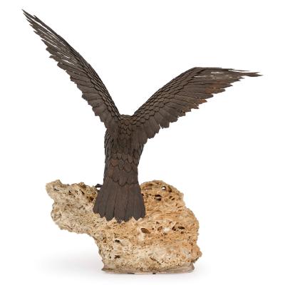 Large patinated steel and rock model of an eagle