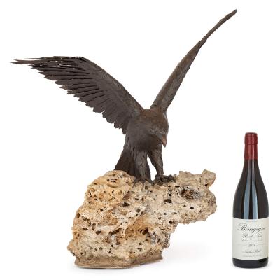 Large patinated steel and rock model of an eagle