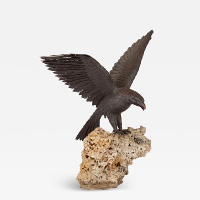 Large patinated steel and rock model of an eagle