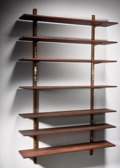 Large shelving unit with brass brackets