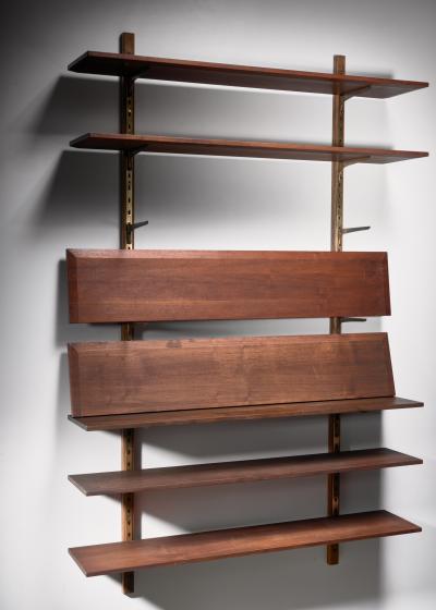 Large shelving unit with brass brackets